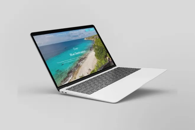 The Blue Destination WordPress website on a laptop